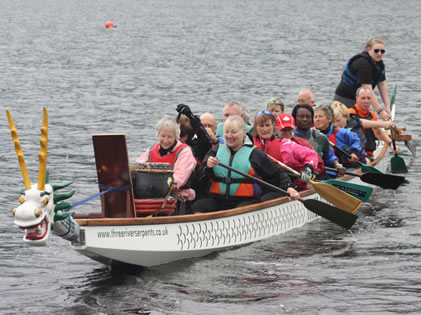 Paddlers for Life take the opportunity in the break to paddle on Loch Ken thanks to the loan of a Three River Serpents boat.