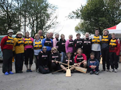 Paddlers show of their new Crewsaver Buoyancy Aids complete with our name!