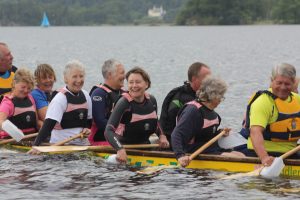 Dragon boat swamping exercise on Windermere for safety practice.