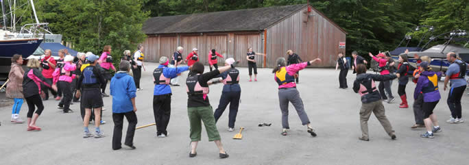 Visitors go through a 'warm up' routine ready to paddle.
