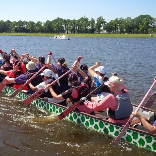 Supporters paddle to race start.