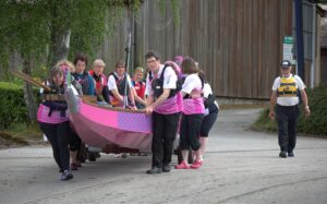 Moving the dragon boat to launch at the slipway.