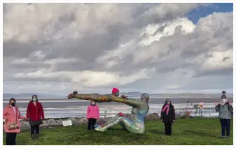 Some members gathered in Morecambe to promote breast cancer awareness month.