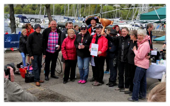 We win the cardboard cup for the best dressed team in the cardboard boat competition.